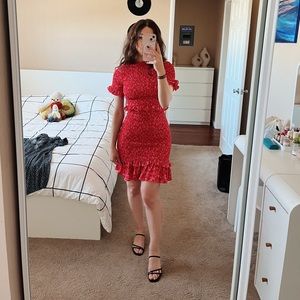Likely designer red dress